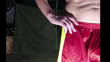dirty gay pig servenaked enjoy to roll in the dirt like a wild boar outdoor in an old barn with 10 pound at his balls